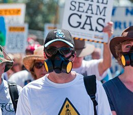 Protestor in gas mask